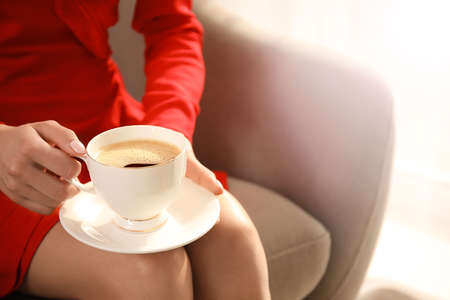 Woman drinking tasty coffee at home, closeupの写真素材