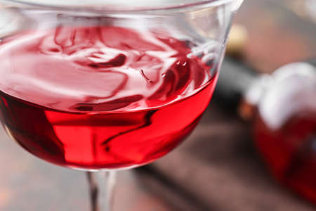 Glass of red wine on table, closeup
