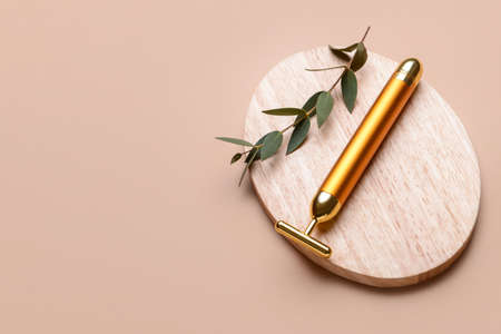 face massage roller on color backgroundの写真素材