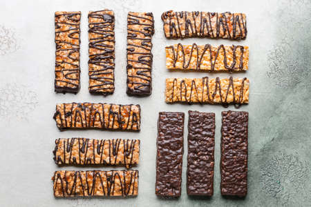 Tasty chocolate nut bars on grunge backgroundの写真素材