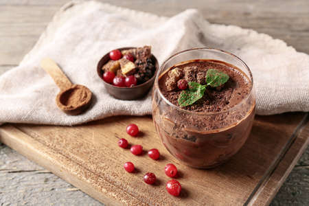 Glass of sweet cocoa dessert on tableの写真素材