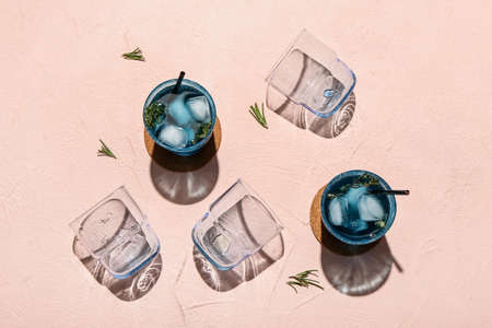 Glasses of fresh cocktail on color backgroundの写真素材