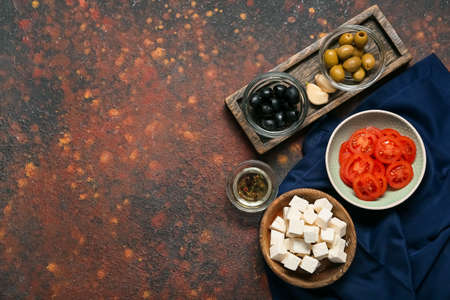 Composition with delicious pieces of feta cheese on grunge backgroundの写真素材