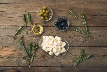 Composition with delicious pieces of feta cheese on wooden backgroundの写真素材