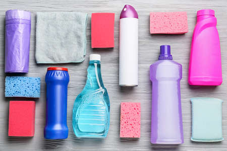 Set of cleaning supplies on wooden backgroundの写真素材