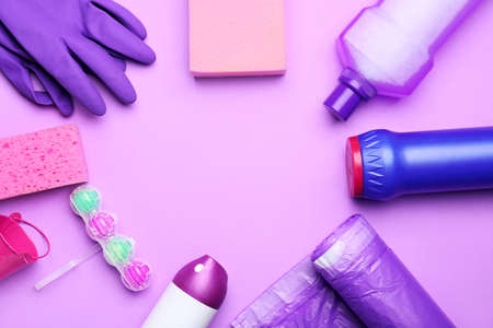 Frame made of cleaning supplies on color backgroundの写真素材