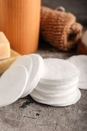 Cotton pads on grunge table, closeupの写真素材
