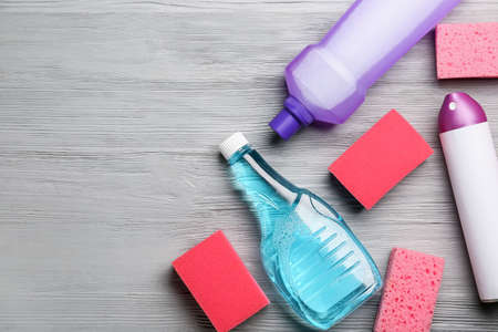Set of cleaning supplies on wooden backgroundの写真素材