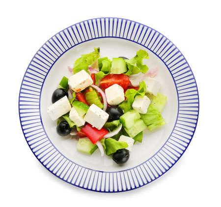 Plate with fresh Greek salad on white backgroundの写真素材