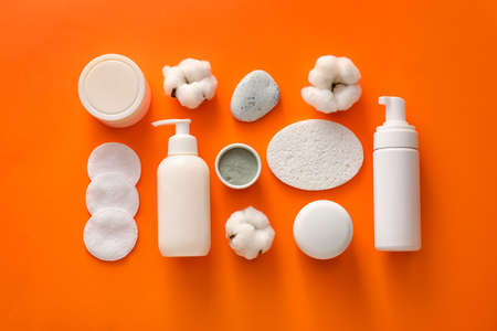 Composition with sponges and bath supplies on color background