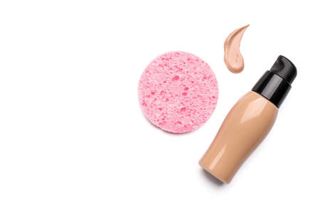 Makeup sponge and foundation with sample on white backgroundの写真素材