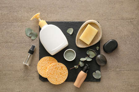 Composition with sponges, cosmetics and bath supplies on grunge backgroundの写真素材