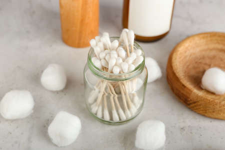 Cotton swabs and balls on light backgroundの写真素材