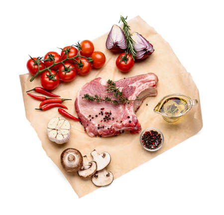 Fresh raw meat with spices and vegetables on white background