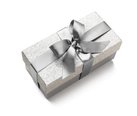 Gift box with silver ribbon on white backgroundの写真素材
