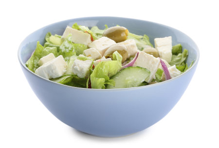 Bowl with fresh Greek salad on white backgroundの写真素材