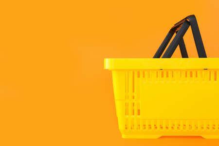 shopping basket on color backgroundの写真素材