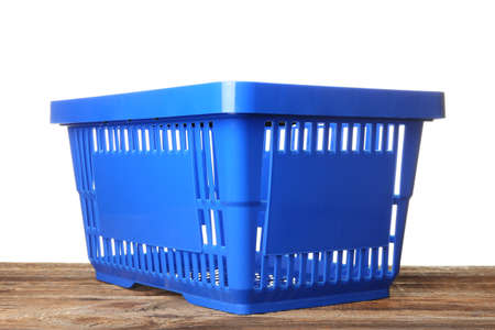 Shopping basket on table against white backgroundの写真素材