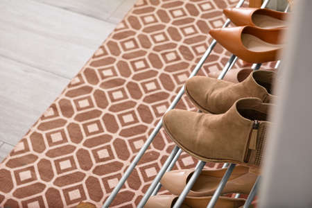 Stylish rug on the floor in the interior of the hallway