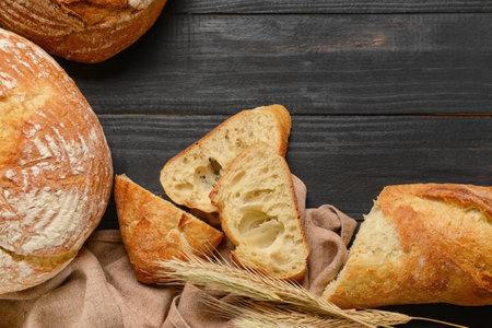 fresh bread on dark wooden background