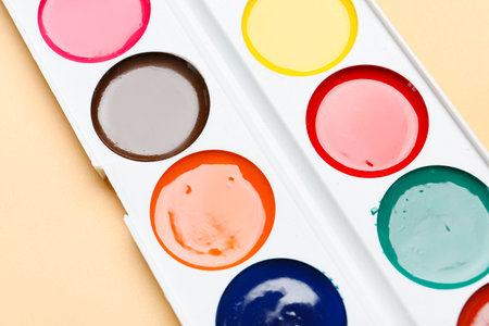 Watercolor paints on color background, closeupの写真素材