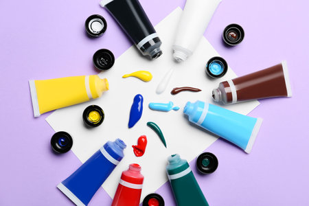 Tubes with paints on color backgroundの写真素材