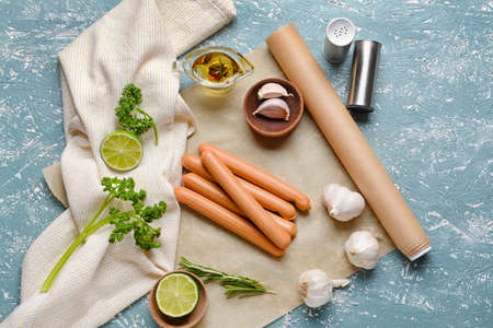 Composition with tasty sausages on color backgroundの写真素材