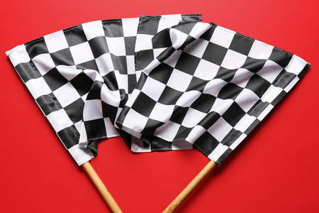 Racing flags on color backgroundの写真素材