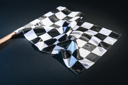 Racing flag on dark backgroundの写真素材