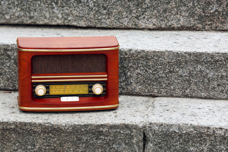 Retro radio receiver on stairs outdoors, closeupの写真素材