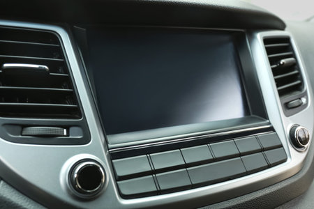Modern radio on dashboard of car, closeupの写真素材