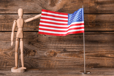 Mannequin and USA flag on wooden backgroundの写真素材