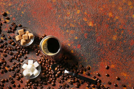 Cup of hot turkish coffee, bowls with sugar and beans on grunge backgroundの写真素材