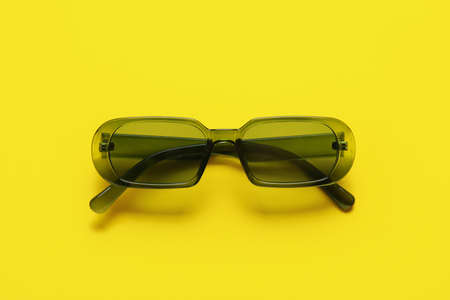 Stylish sunglasses on color backgroundの写真素材