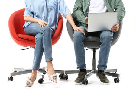 Beautiful young secretary seducing her boss on white background. concept of harassmentの写真素材