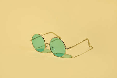 Stylish sunglasses on color backgroundの写真素材