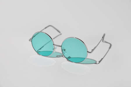 Stylish sunglasses on light backgroundの写真素材
