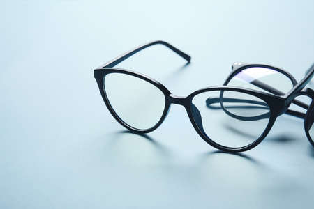 Different stylish eyeglasses on color background, closeupの写真素材