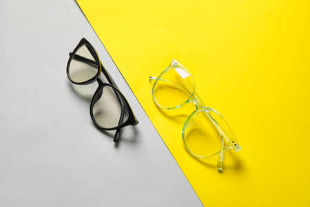 Different stylish eyeglasses on color backgroundの写真素材
