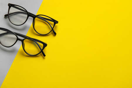 Different stylish eyeglasses on color backgroundの写真素材