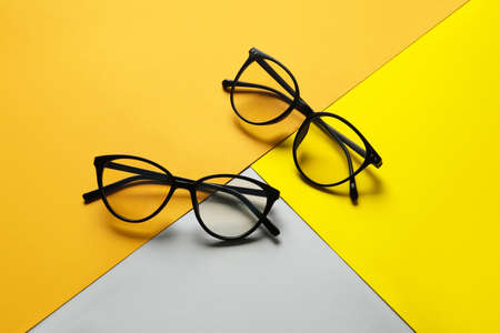 Different stylish eyeglasses on color backgroundの写真素材