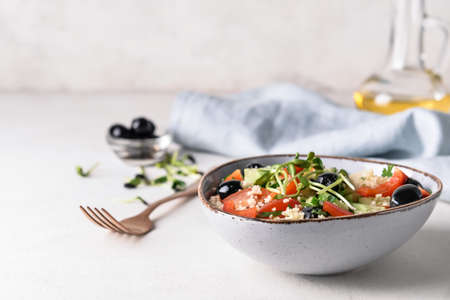 Bowl with couscous and vegetables on light background, closeupの写真素材
