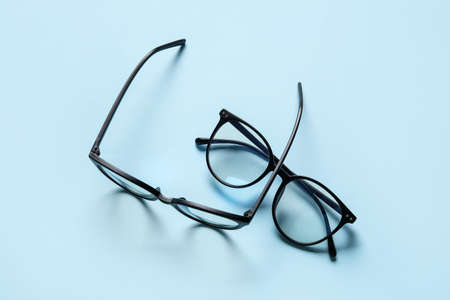 Different stylish eyeglasses on color backgroundの写真素材