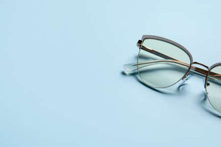 Stylish eyeglasses on color background, closeupの写真素材