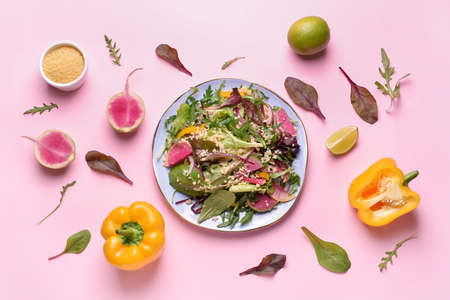 Composition with tasty couscous and vegetables on color backgroundの写真素材