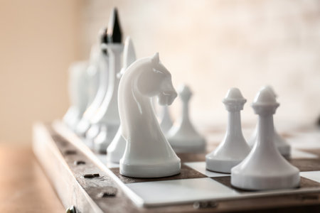 Game board with chess pieces on table, closeupの写真素材