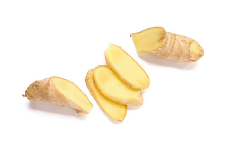 Sliced fresh ginger on white backgroundの写真素材