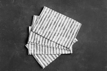 Stylish napkins on black background