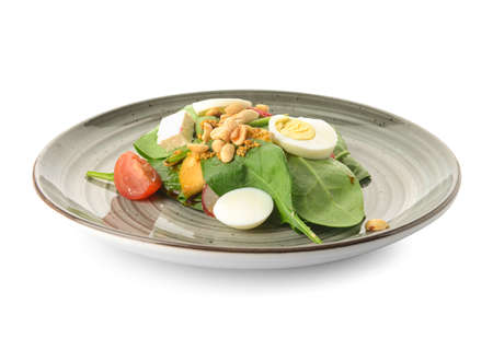 Plate with delicious salad with peanuts on white backgroundの写真素材