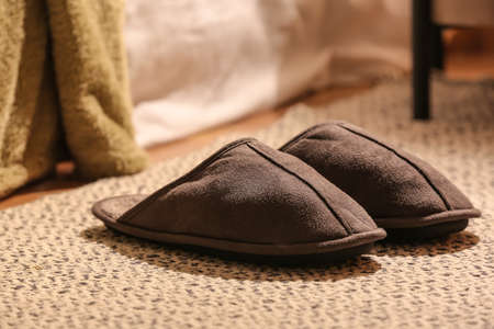 Male soft slippers on rug, closeupの写真素材